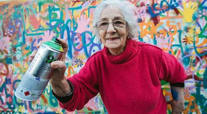 An architect teaching senior citizens how to do street art
